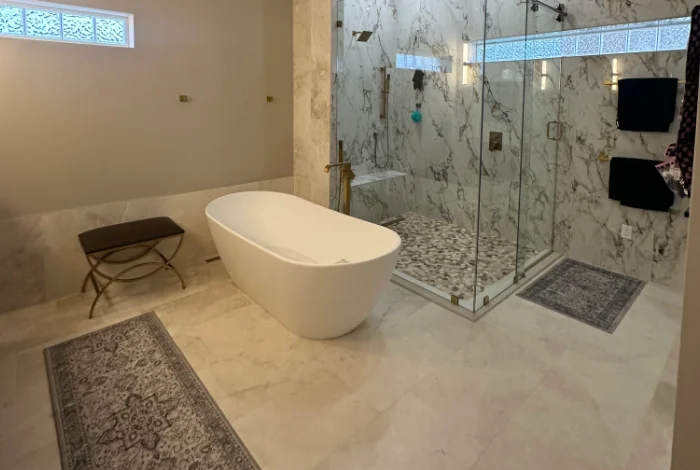Finished luxury bathroom remodel featuring a freestanding tub and marble glass shower, showcasing the expert craftsmanship of Power Pro Maintenance & Repairs LLC.